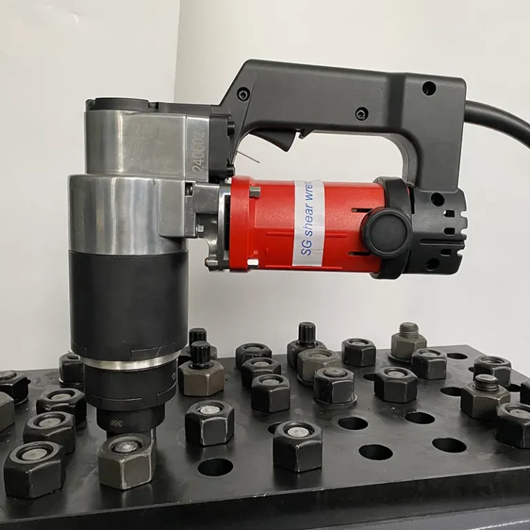 Worker using a shear wrench to tighten structural bolts